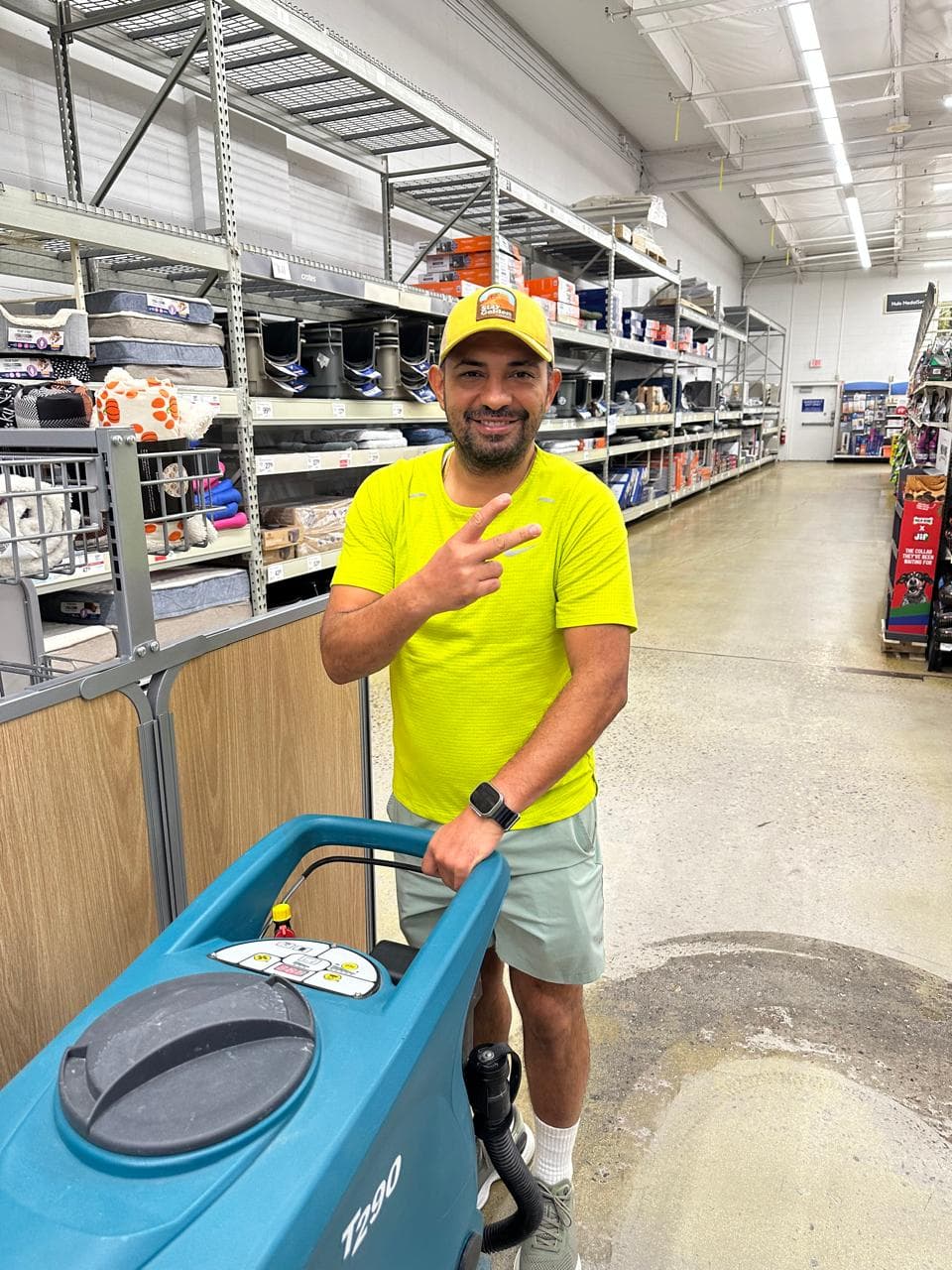 Kathy Clean janitorial technician with a Tennant floor scrubber inside a PetSmart in the Denver metro area