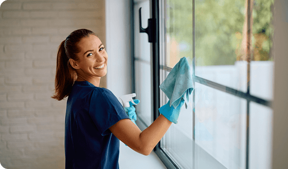 Professional window cleaner washing windows